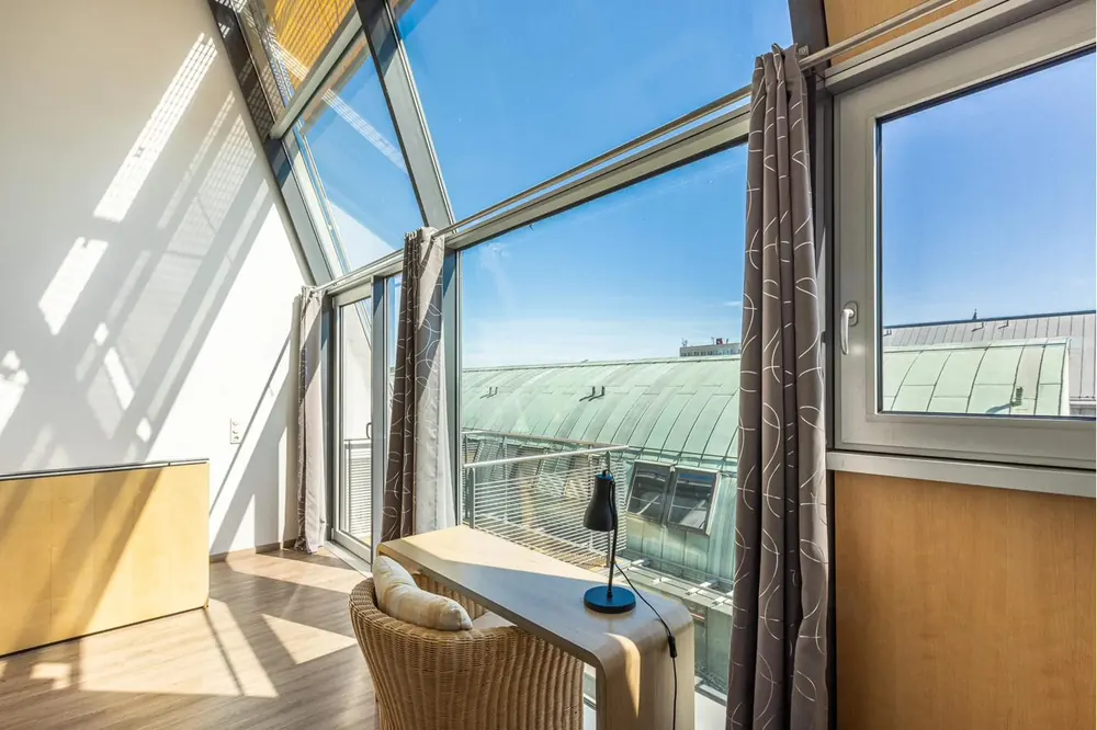 CopperRoof Apartment mit raumhoher Fensterfront